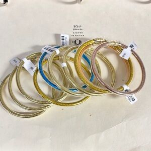 Set of 10 glitter tube bracelets.